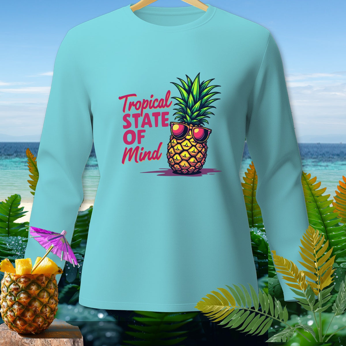 Light blue long-sleeved shirt with a graphic of a pineapple wearing sunglasses and text.