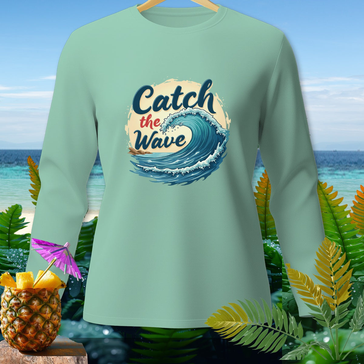 Light teal long-sleeve shirt with "Catch the Wave" text and ocean wave graphic.