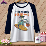 Skeleton wearing Hawaiian shirt and sunglasses, holding surfboard and pumpkin candy bucket.