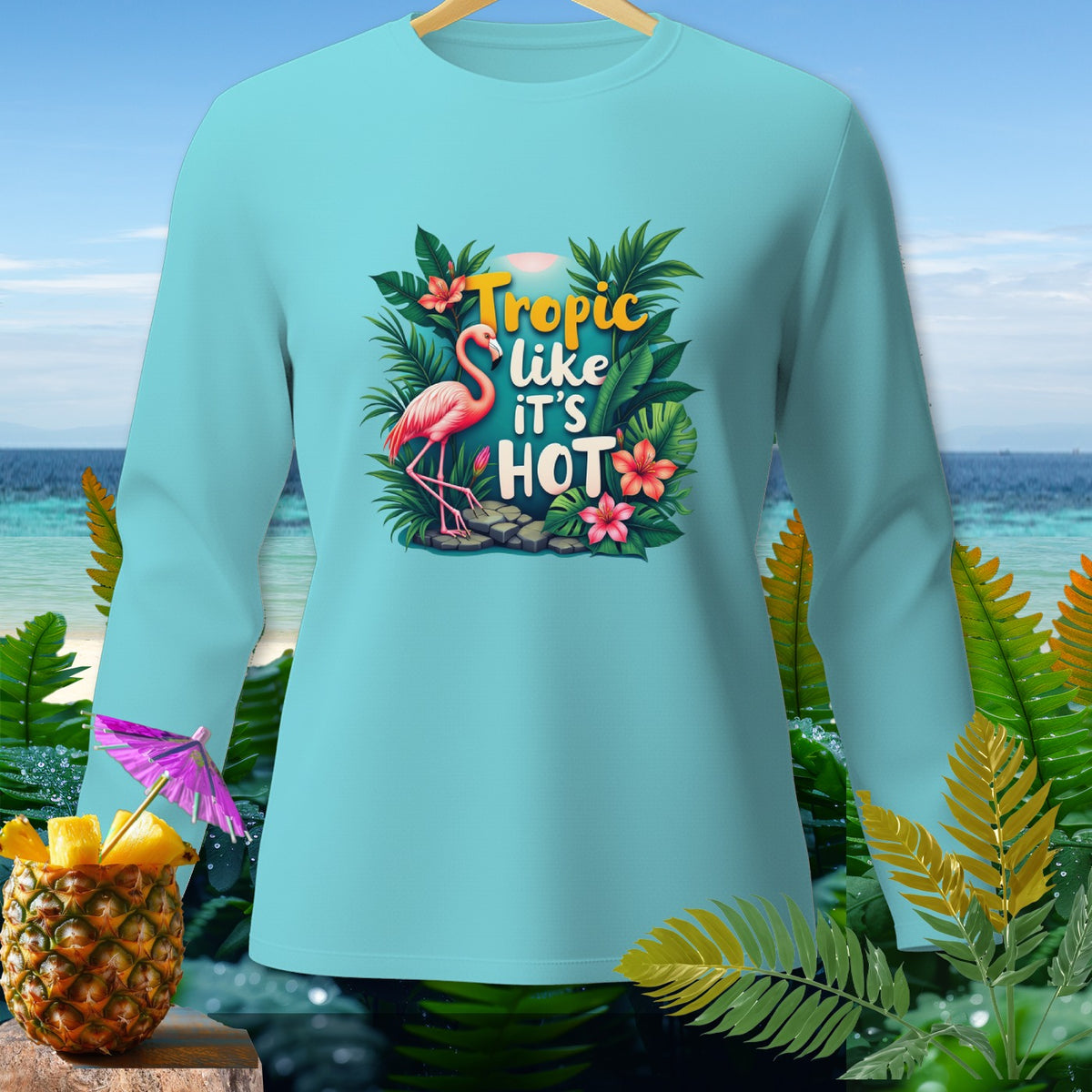 Light blue long sleeve shirt with "Tropic like IT'S HOT" text and flamingo.