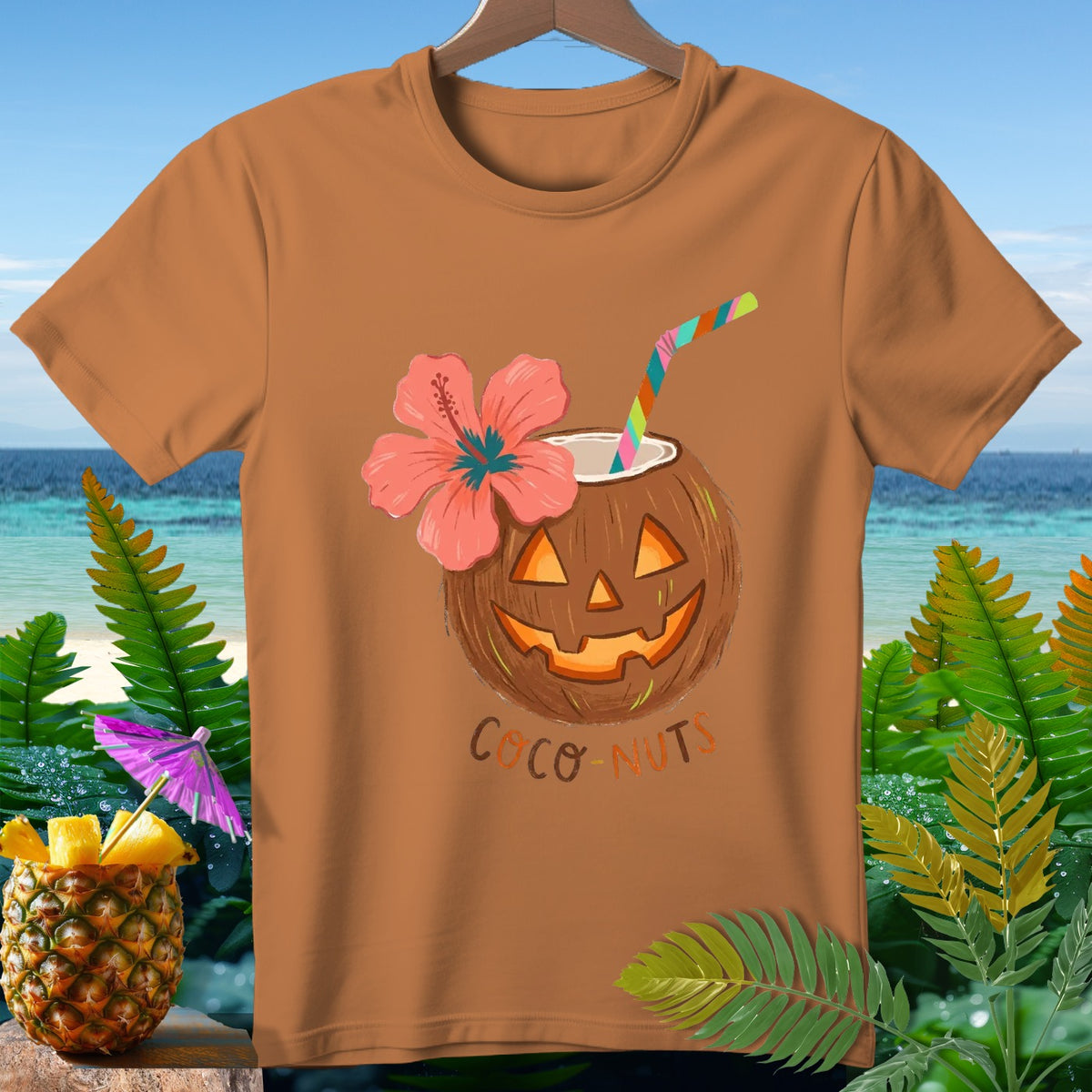 Orange t-shirt with a jack-o'-lantern coconut drink with a hibiscus flower and straw.
