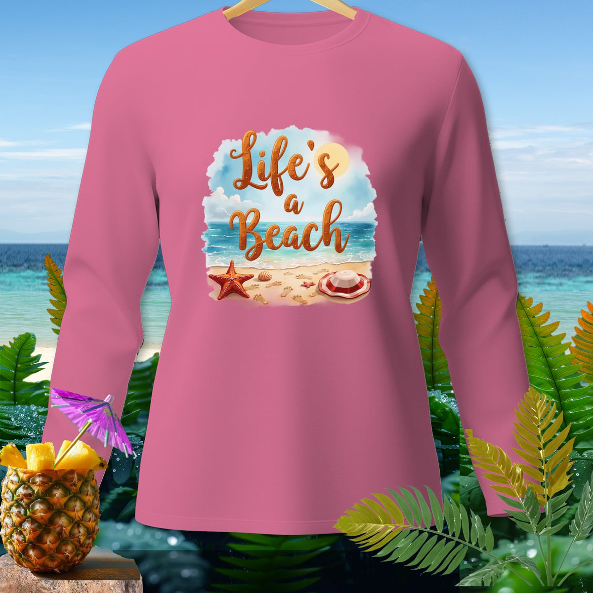 Pink long-sleeved shirt with "Life's a Beach" graphic and beach scene.