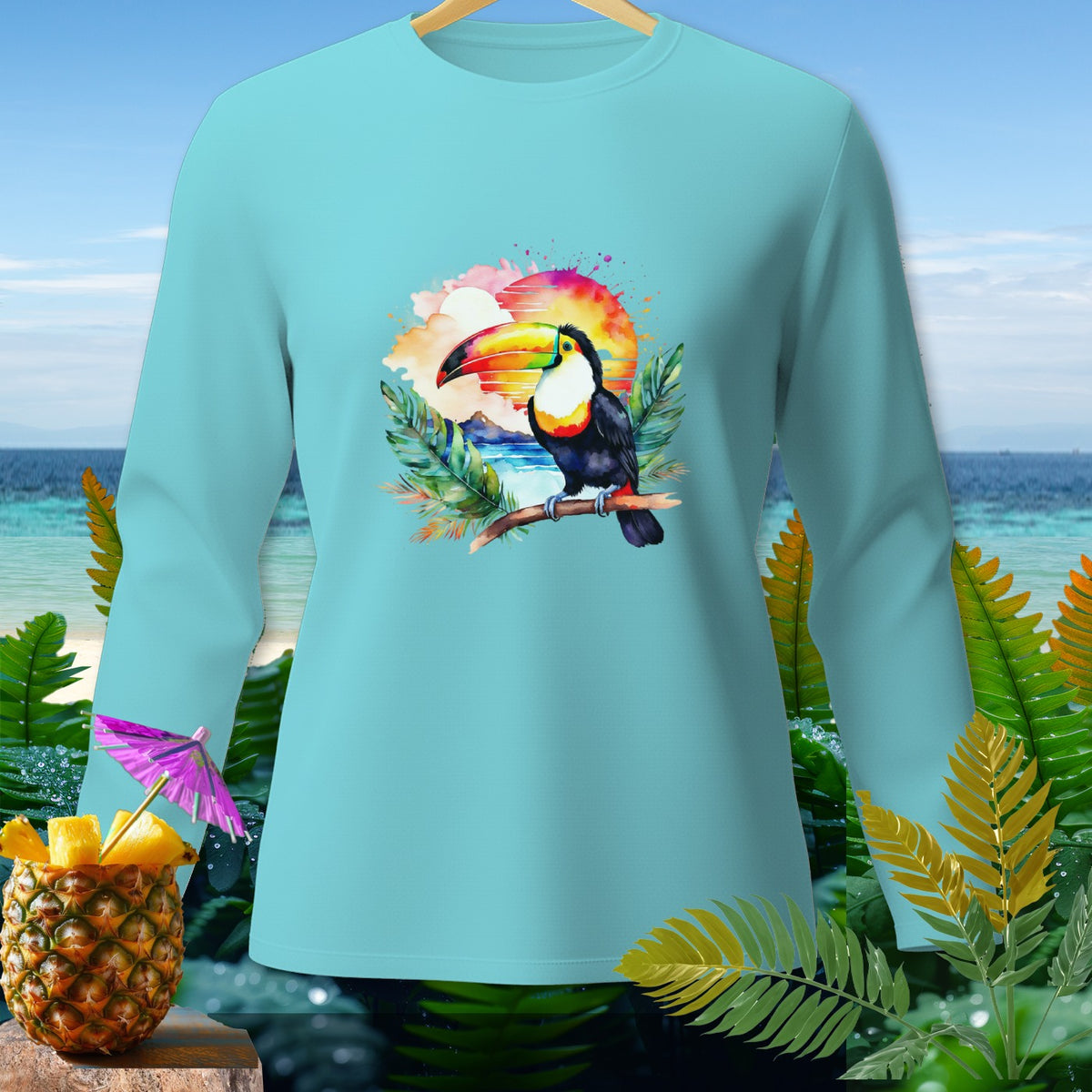 Long-sleeve light blue shirt with a toucan and sunset graphic.