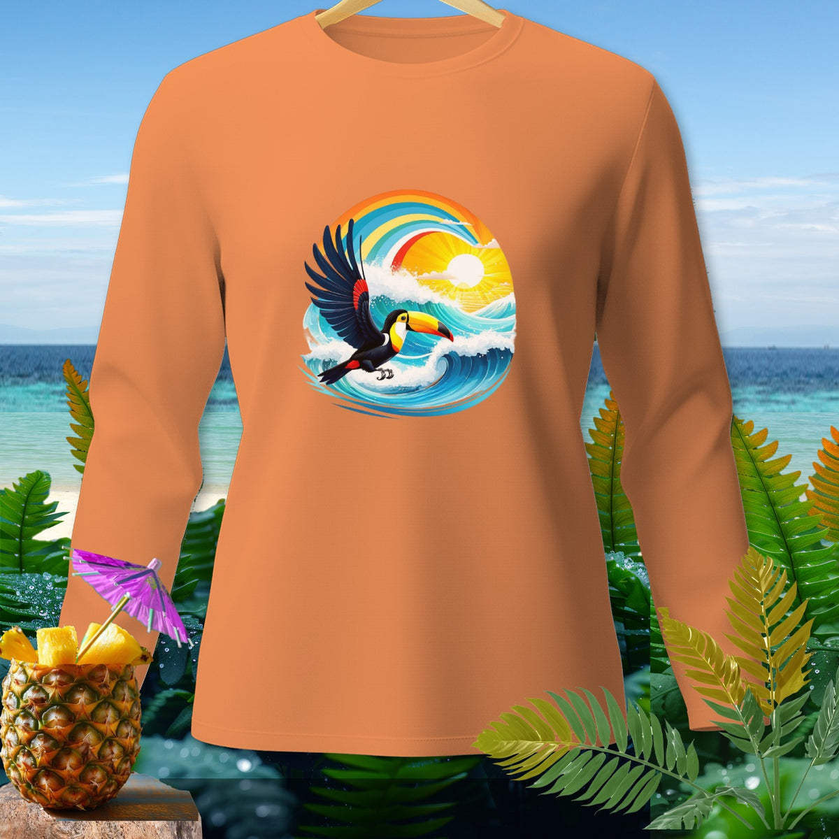 Orange long-sleeve shirt with a toucan, ocean waves, and rainbow graphic.