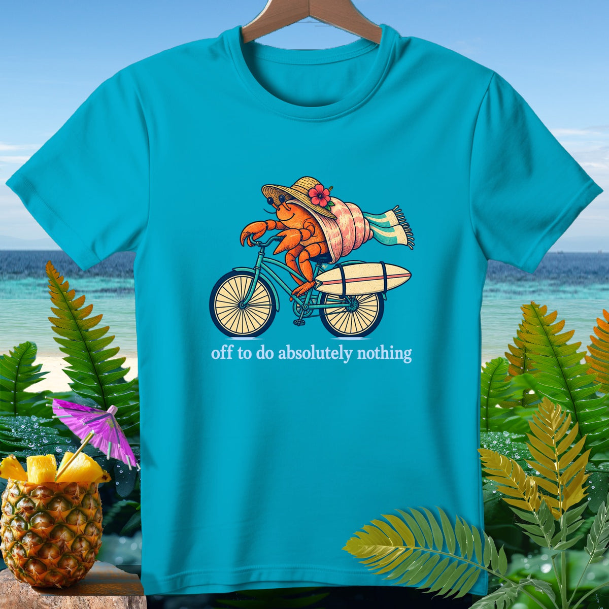Hermit crab riding a bicycle with a surfboard and text "off to do absolutely nothing".