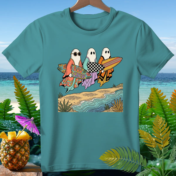 Three ghosts in sunglasses and robes carry surfboards on a beach.