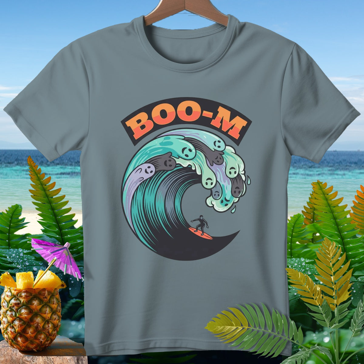 T-shirt with "BOO-M" text above a surfing skeleton on a wave with ghosts.