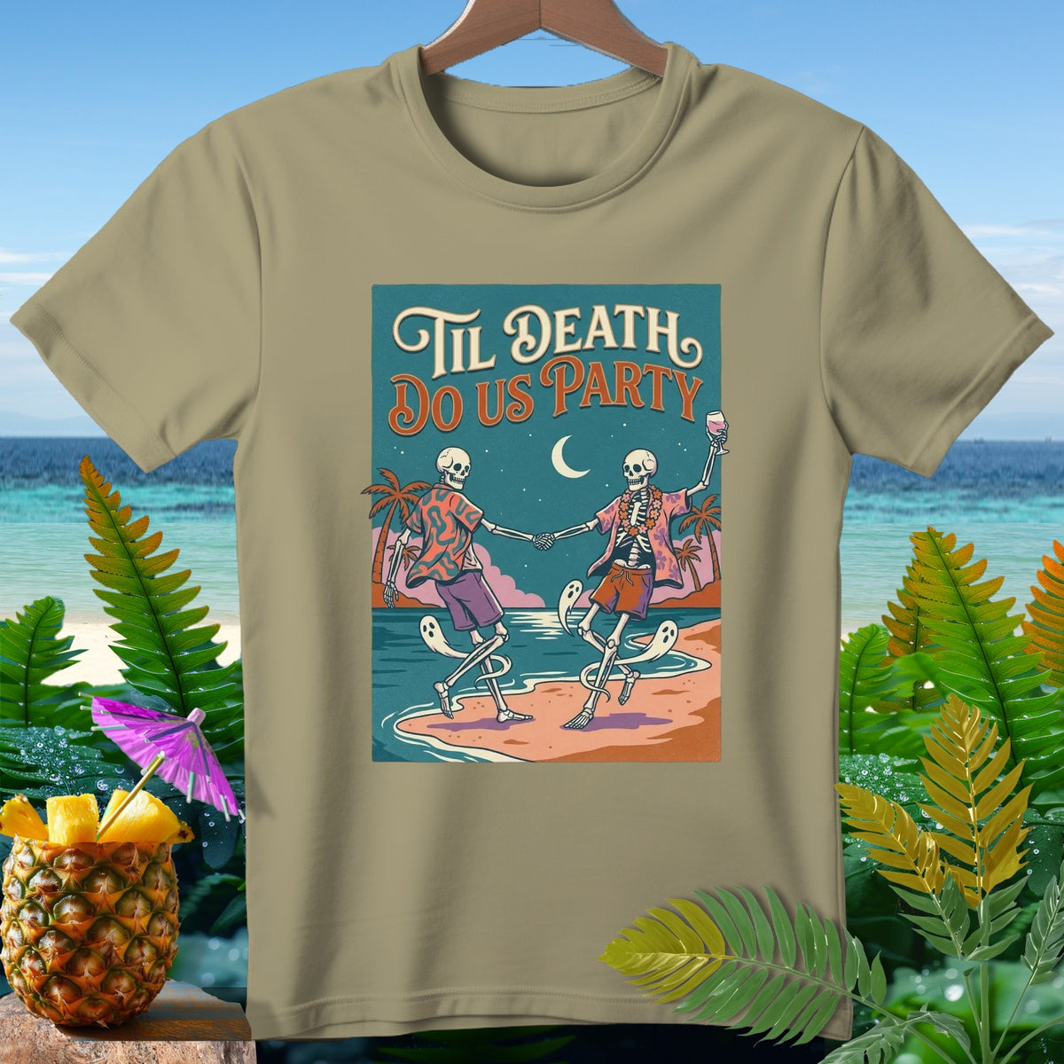 T-shirt graphic of skeletons dancing on beach with text "Til Death Do Us Party".
