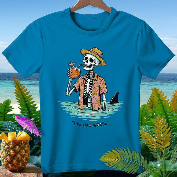 Skeleton in Hawaiian shirt and straw hat drinks coconut, shark fin nearby, text "I'VE HAD WORSE."
