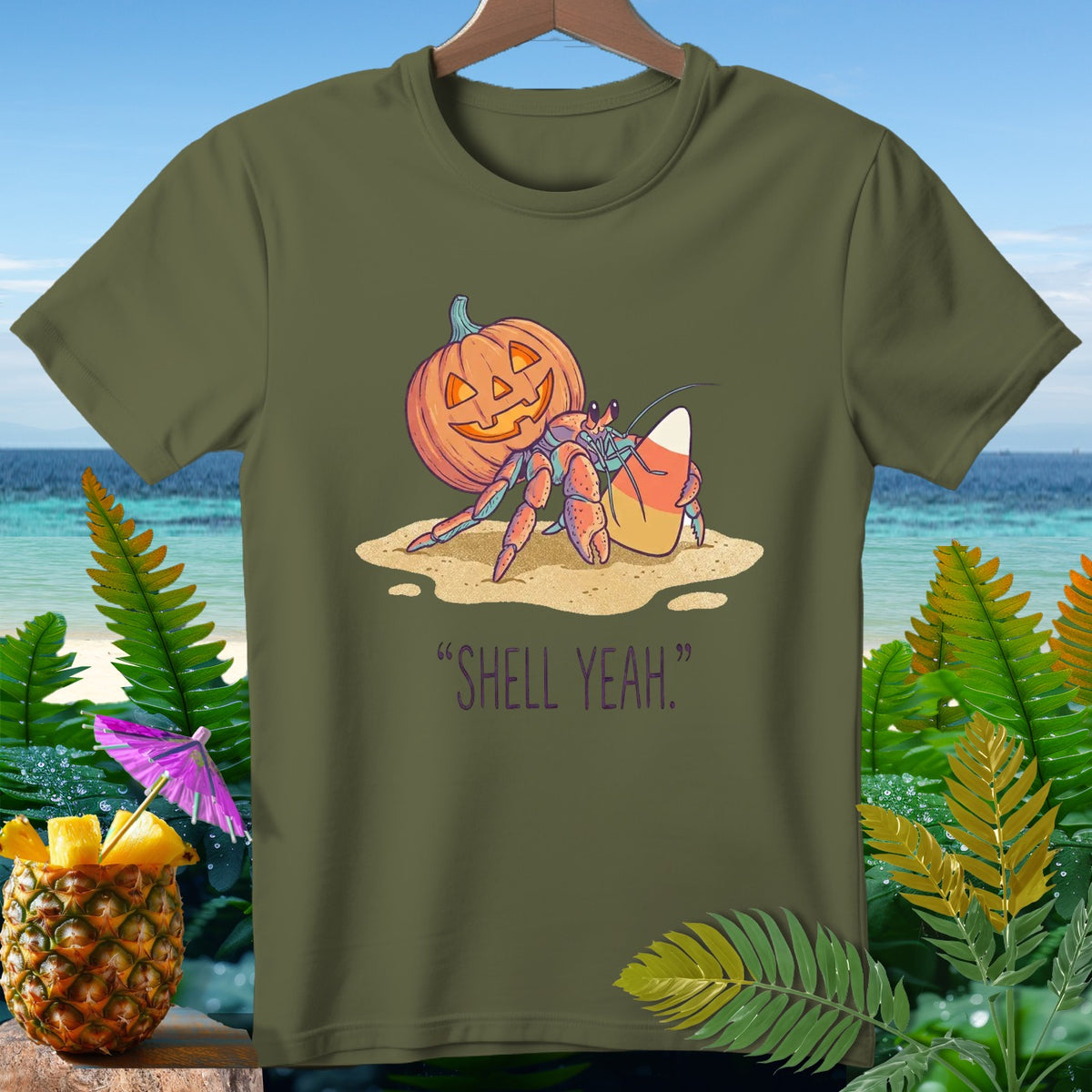 Hermit crab with pumpkin and candy corn on sand, "Shell Yeah."