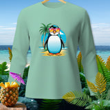 Light teal long-sleeve shirt with a graphic of a penguin wearing sunglasses on a beach.