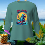 Long sleeve shirt with a teal blue chameleon in sunglasses on a beach chair.