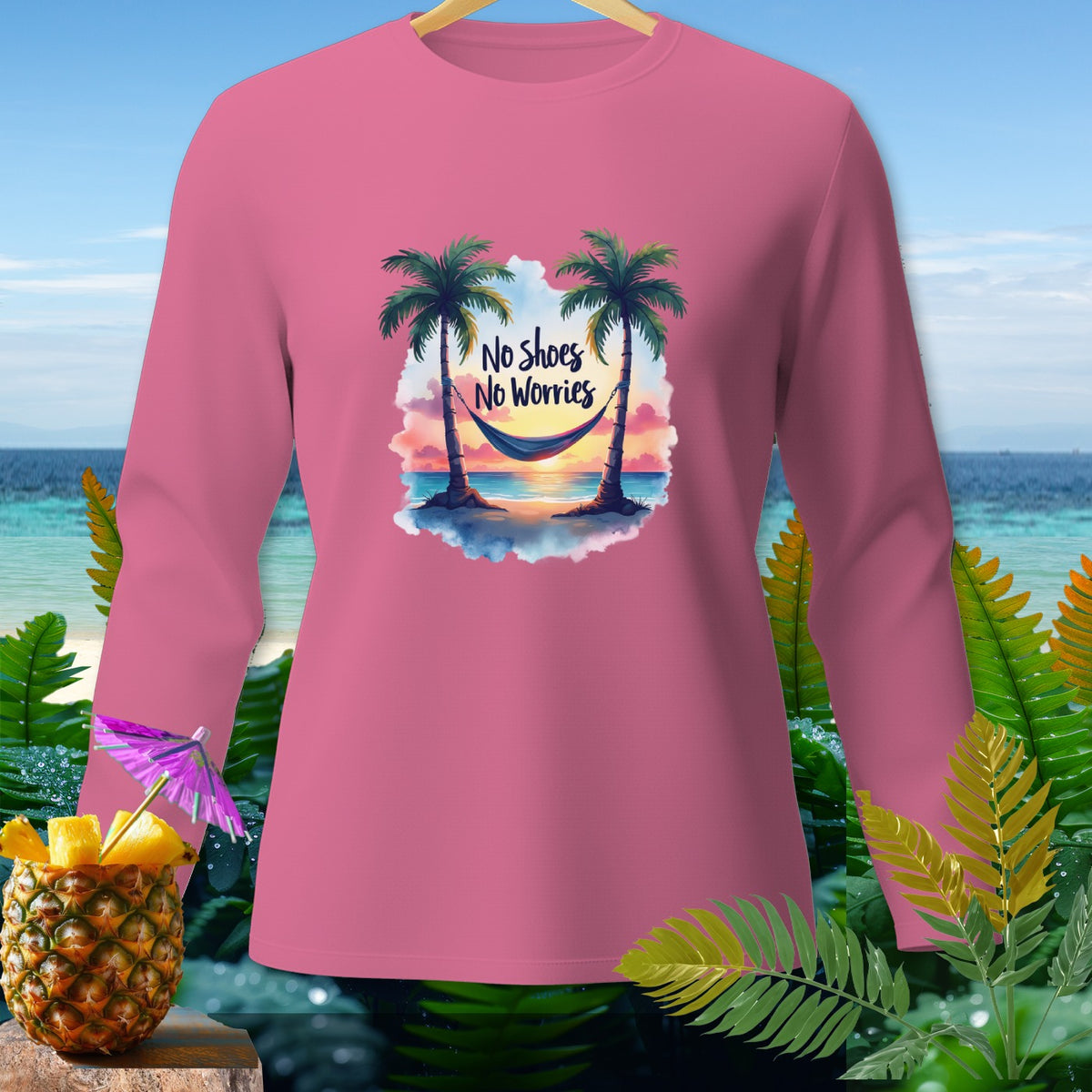 Pink long-sleeve shirt with "No Shoes No Worries" and a beach hammock graphic.