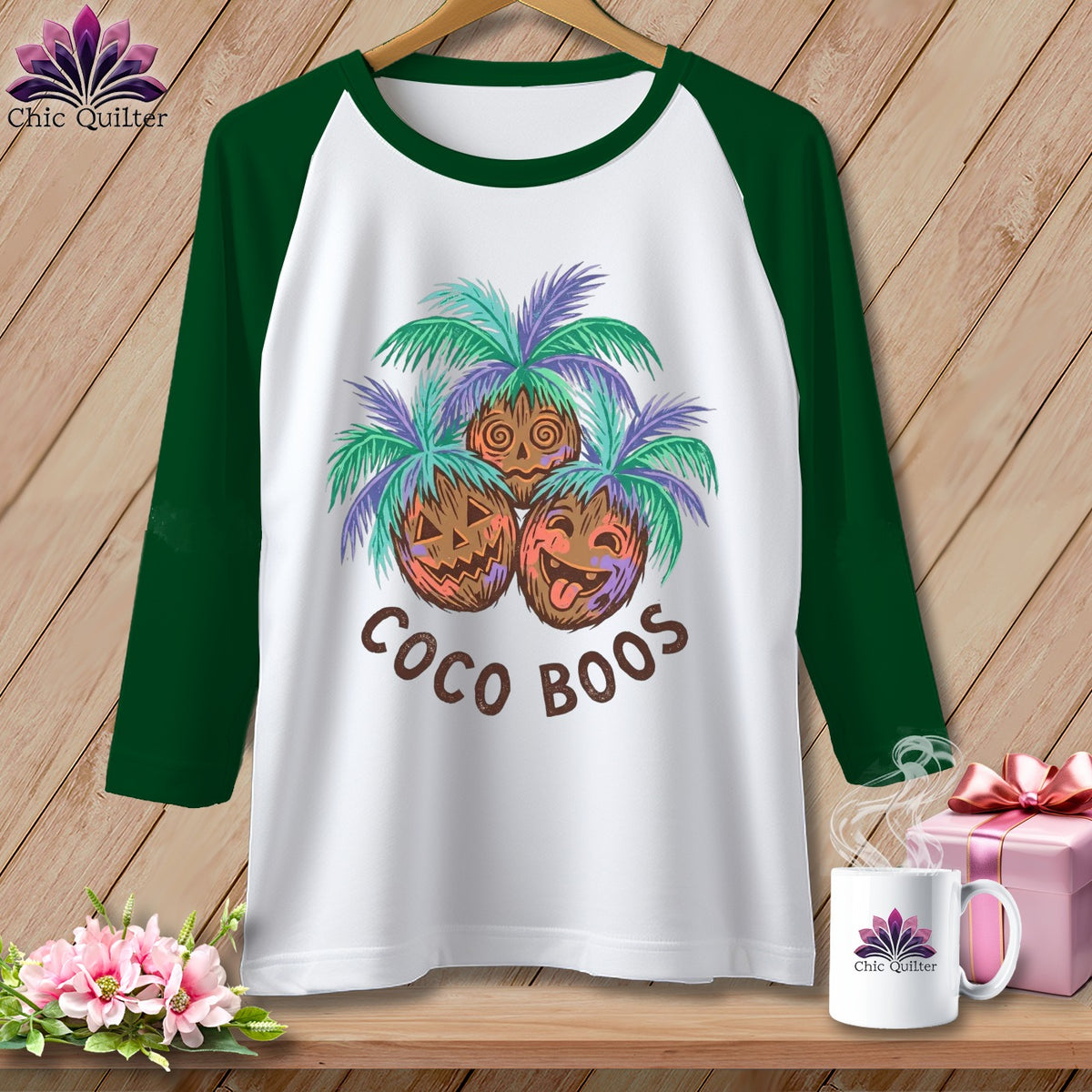 White baseball tee with "Coco Boos" and three jack-o'-lantern coconuts with palm fronds.