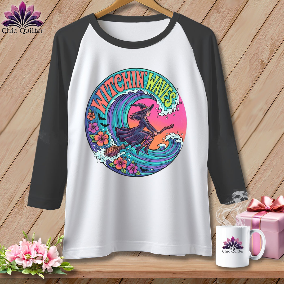T-shirt with "Witchin Waves" graphic of a witch flying on a broomstick over a wave.