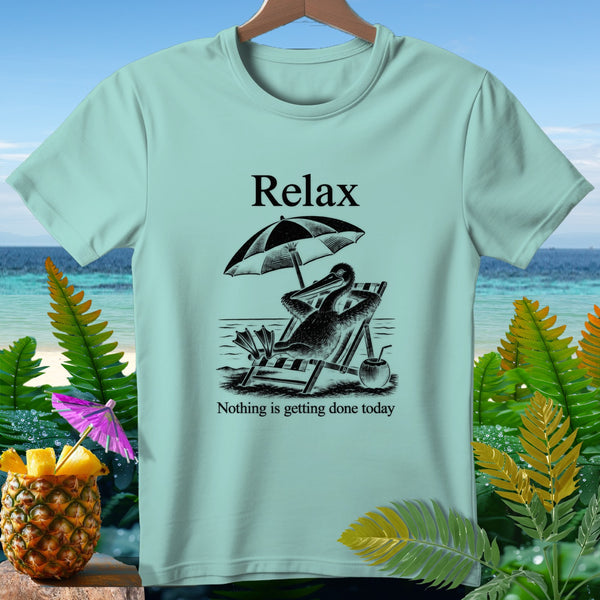 Light blue t-shirt with black graphic of pelican relaxing on beach chair under umbrella.