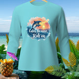 Light blue long-sleeve shirt with dolphins jumping over waves and text 