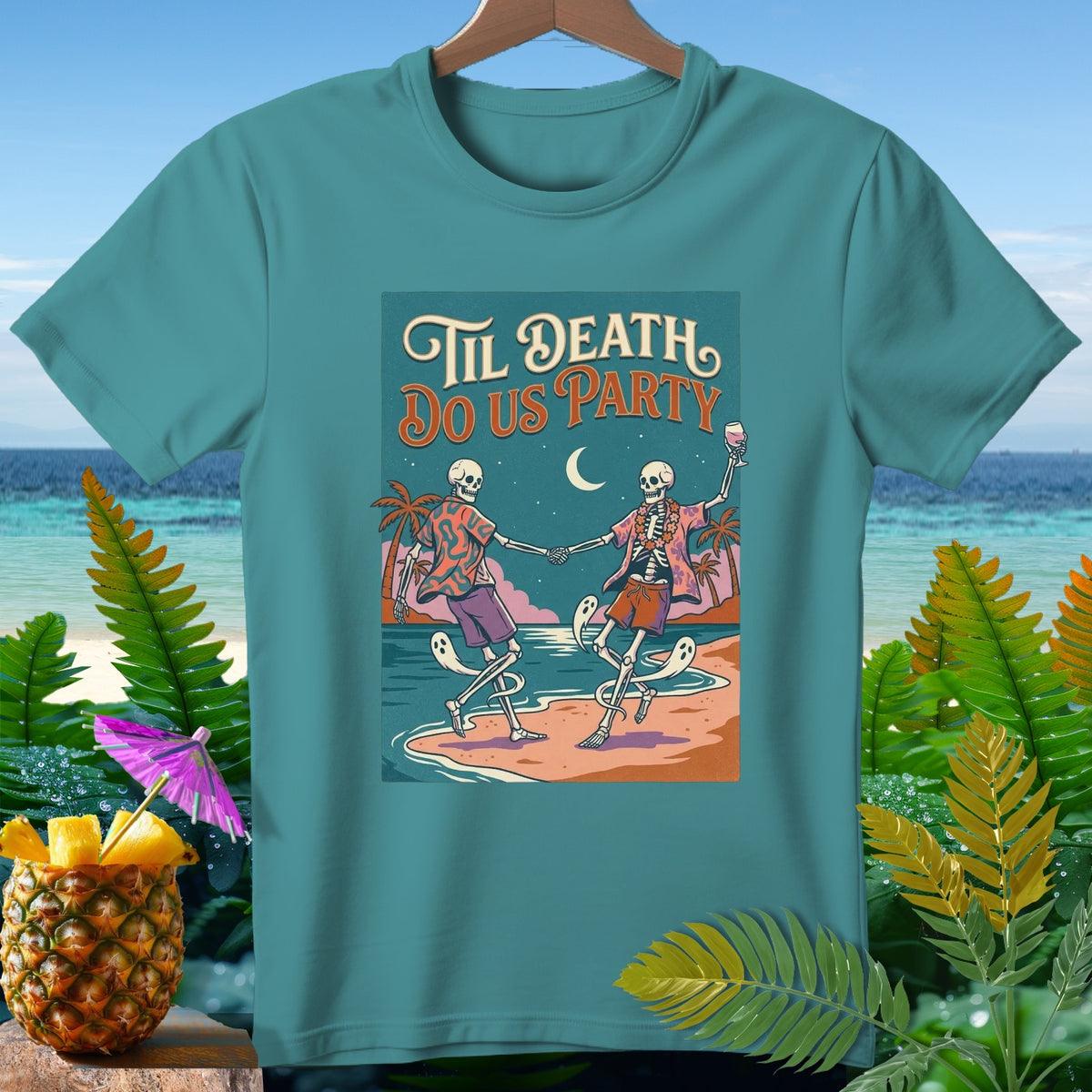 T-shirt with skeletons dancing on a beach, text "Til Death Do Us Party".