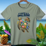 Green t-shirt with cartoon sea turtles, patchwork shell, and text 