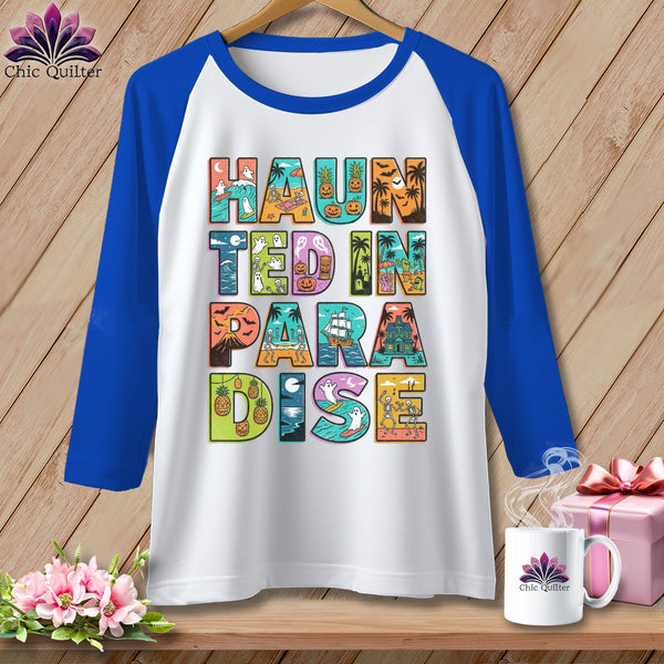 White baseball tee with "Haunted in Paradise" text and Halloween beach themes.