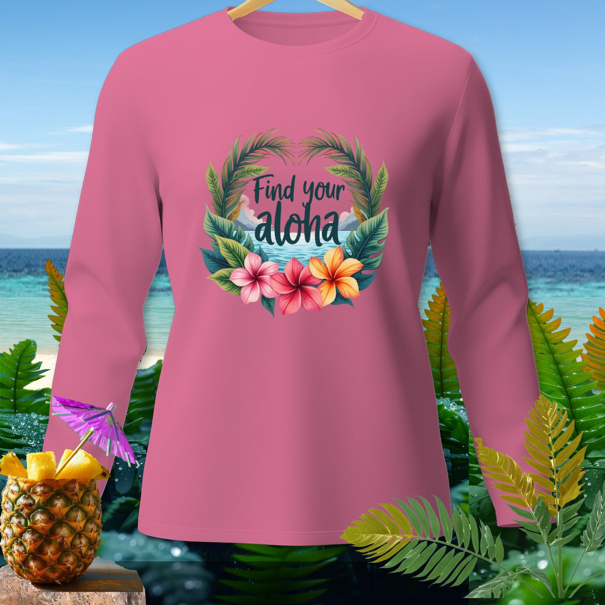 Pink long-sleeve shirt with "Find your aloha" text and floral design.