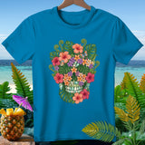 Blue t-shirt with a floral skull design and tropical background.