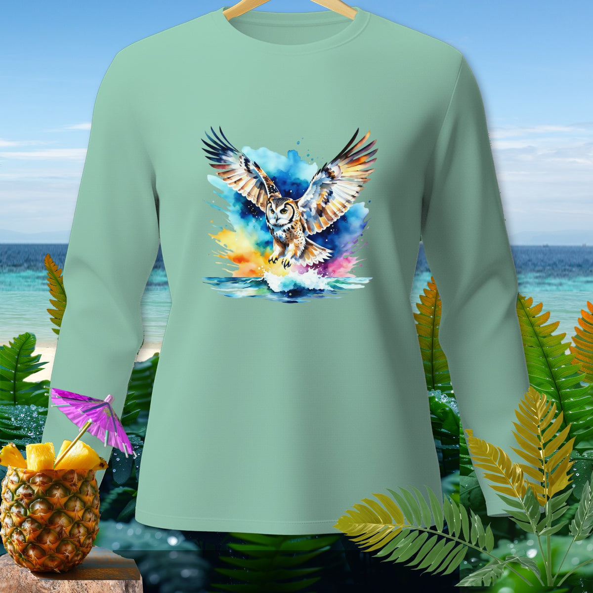 Light teal long-sleeve shirt with a watercolor owl design over water.
