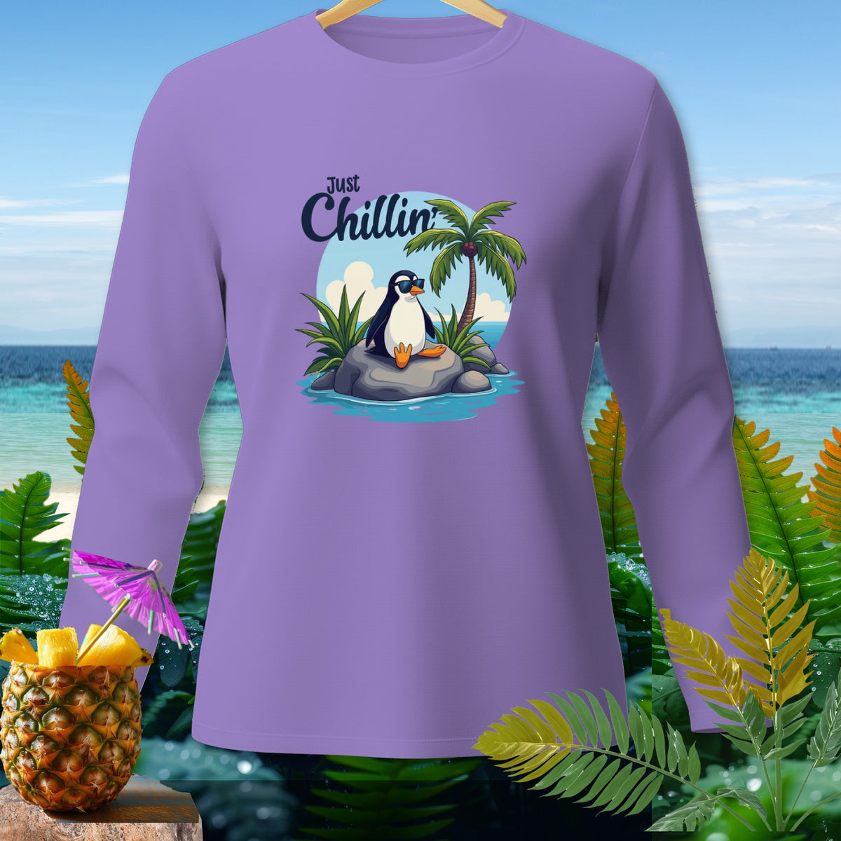 Lavender long-sleeve shirt with a cartoon penguin wearing sunglasses and text "Just Chillin'".
