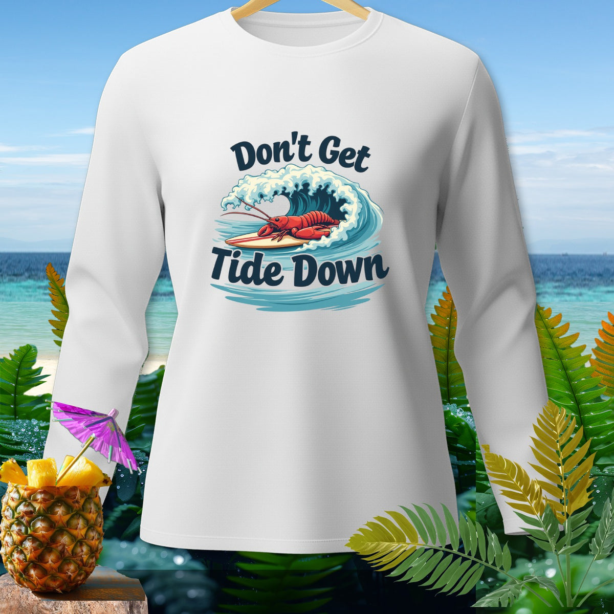 White long-sleeve shirt with a lobster surfing a wave and text "Don't Get Tide Down".