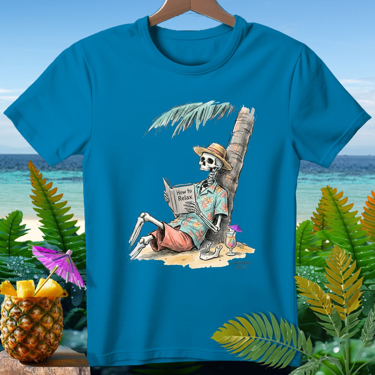Skeleton reading "How to Relax" under a palm tree on a beach with a cocktail.