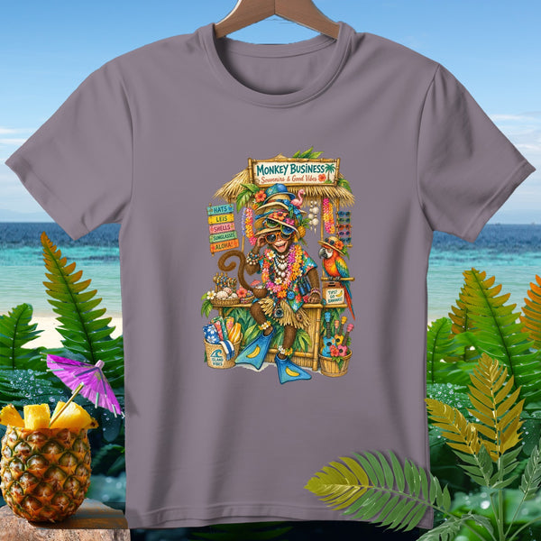 Monkey wearing leis and sunglasses at a souvenir stand called "Monkey Business" with a parrot.