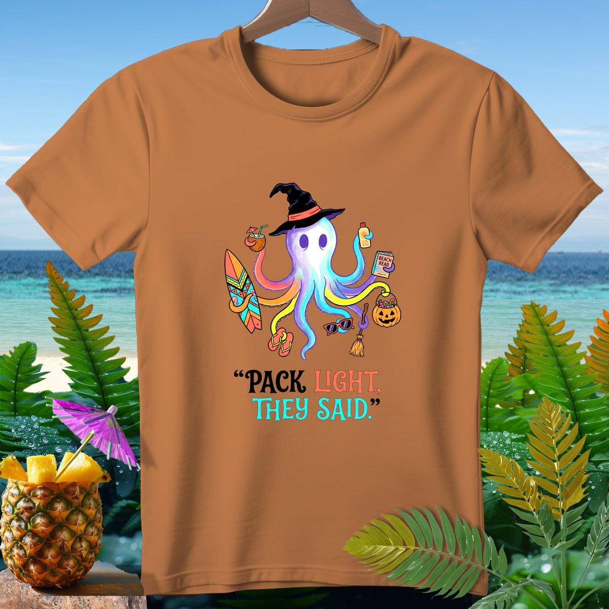 Halloween octopus wearing witch hat, holding beach items, with text "PACK LIGHT. THEY SAID."