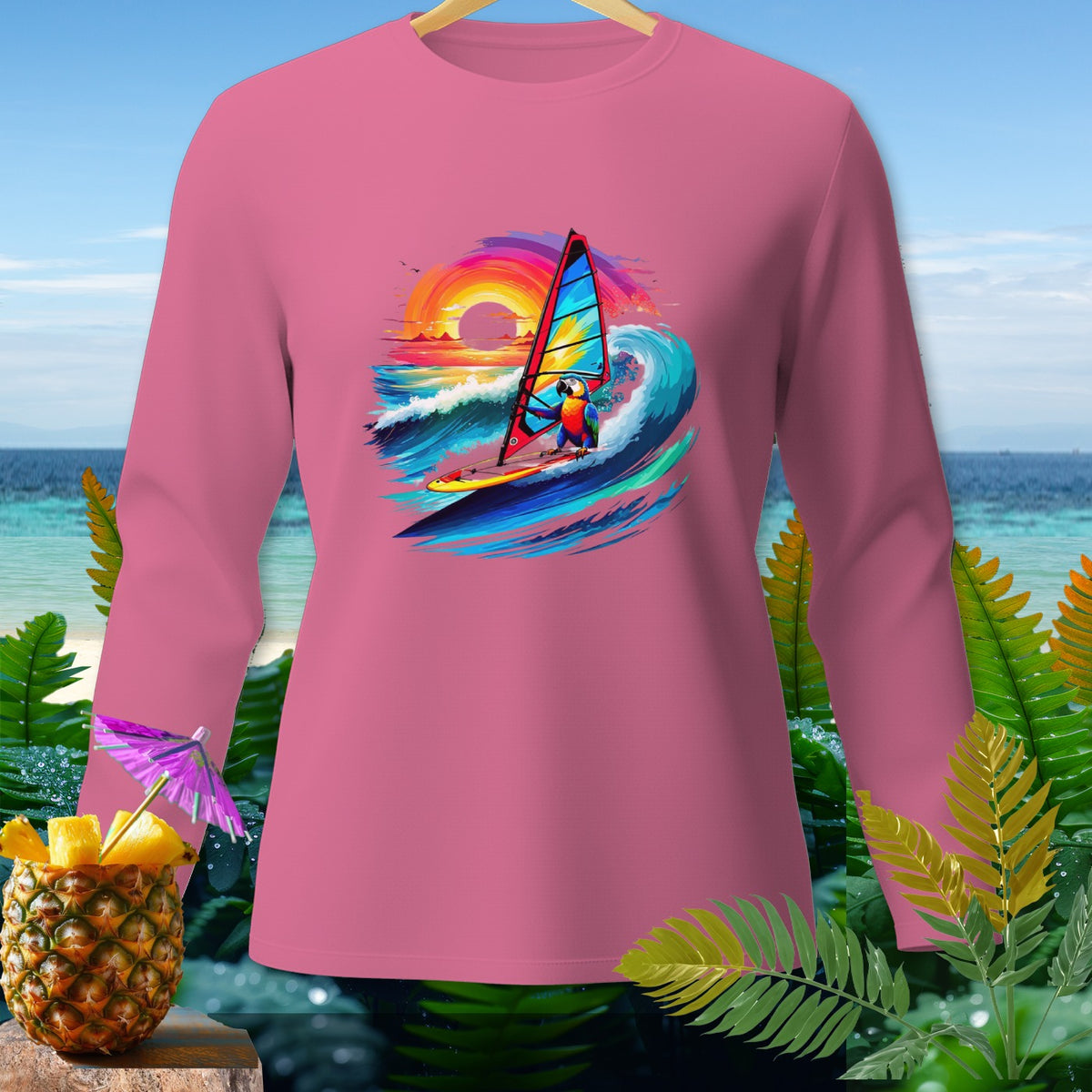 Pink long-sleeved shirt with parrot windsurfing graphic and tropical background.