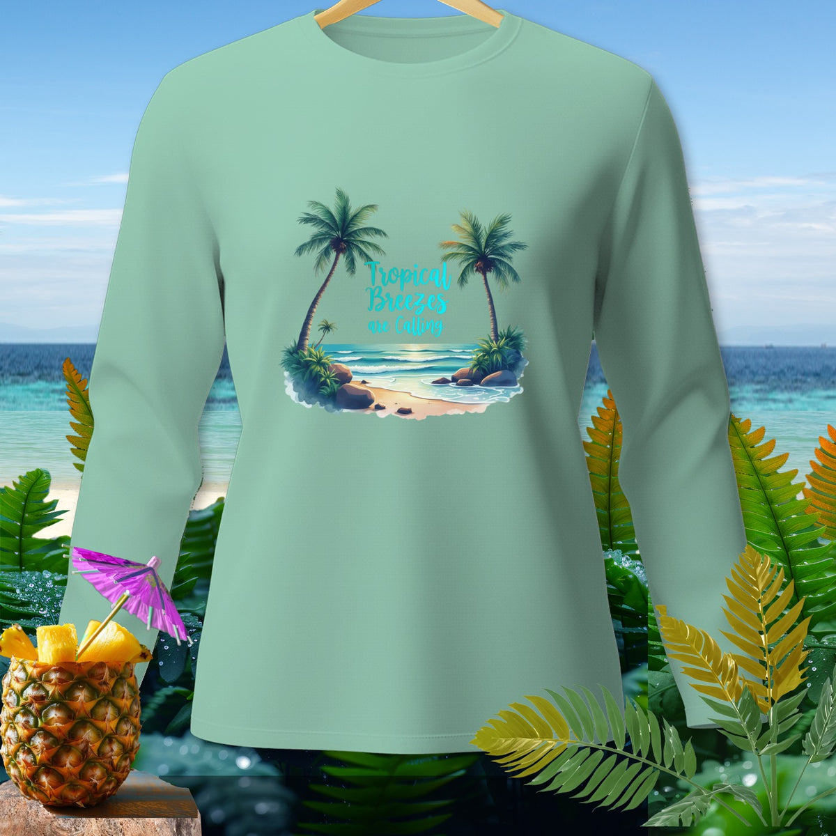 Mint long-sleeve shirt with "Tropical Breezes are Calling" beach graphic.