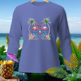Purple long-sleeve shirt with flamingos, palm trees, and beach chairs graphic.