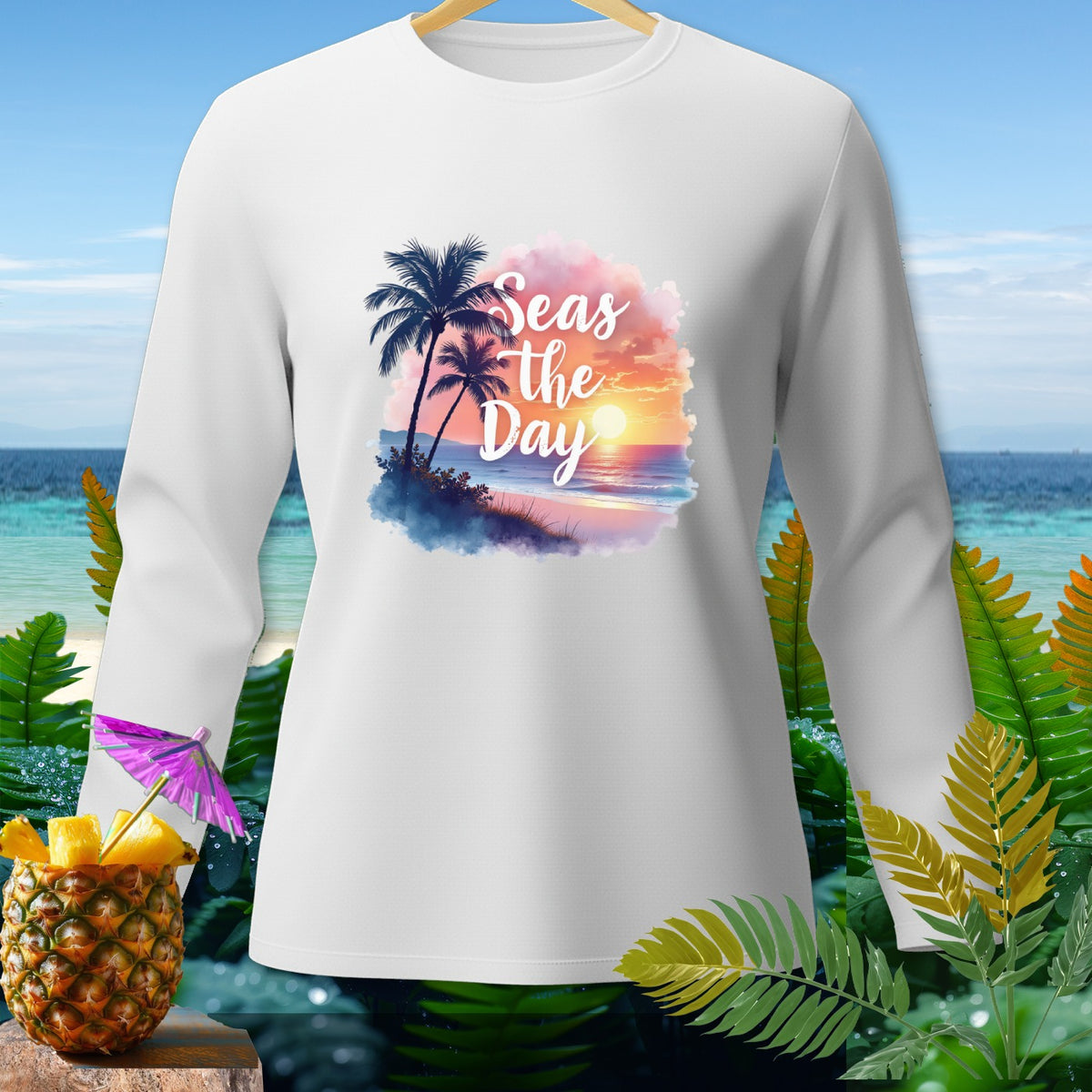 White long-sleeve shirt with "Seas the Day" beach sunset graphic.
