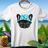 White t-shirt with a black French bulldog wearing a blue hibiscus-patterned bucket hat.