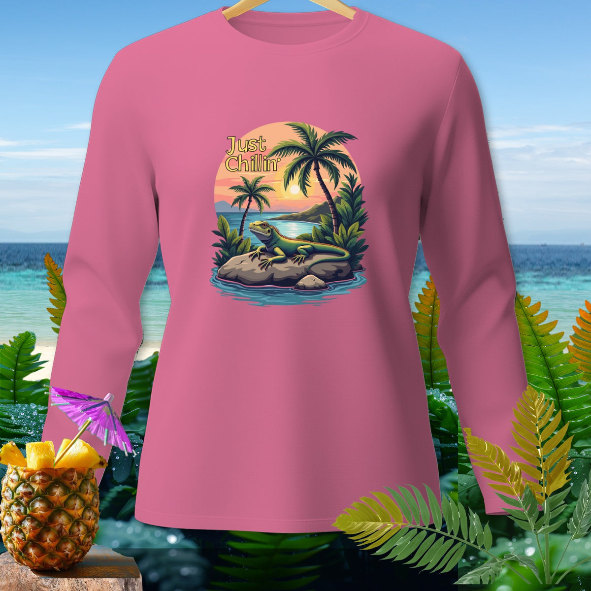 Pink long-sleeve shirt with "Just Chillin" text and iguana graphic.