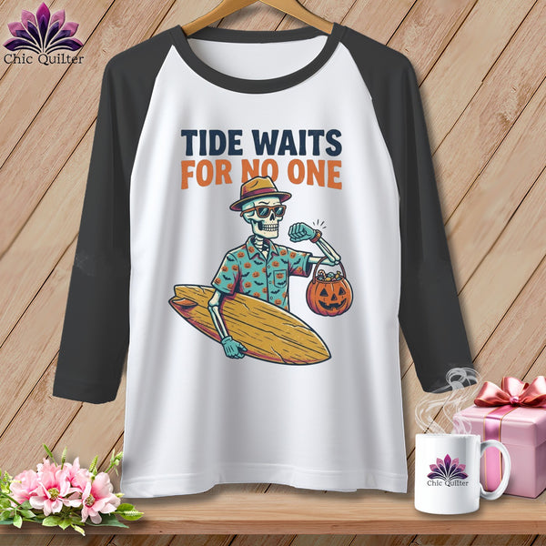 Skeleton holding surfboard and pumpkin candy bucket with text "Tide Waits For No One".