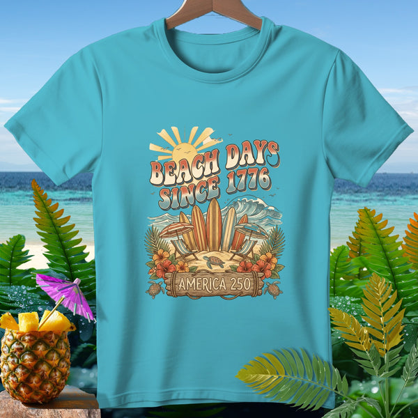 Teal shirt with "Beach Days Since 1776 America 250" beach graphic.