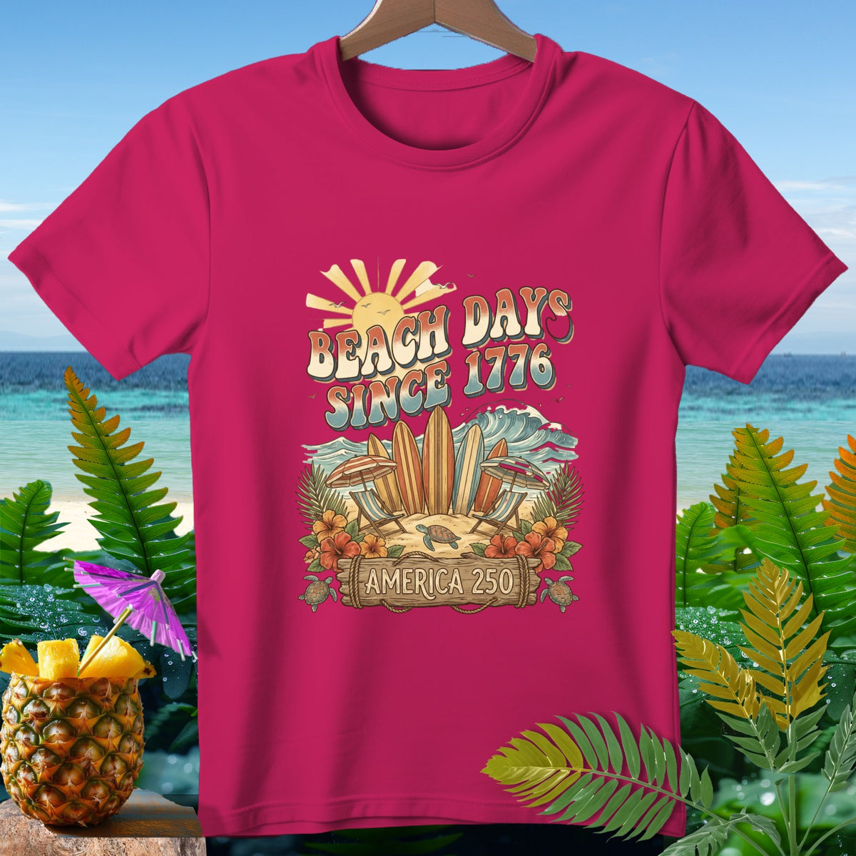 Pink t-shirt with "Beach Days Since 1776 America 250" text and beach graphics.