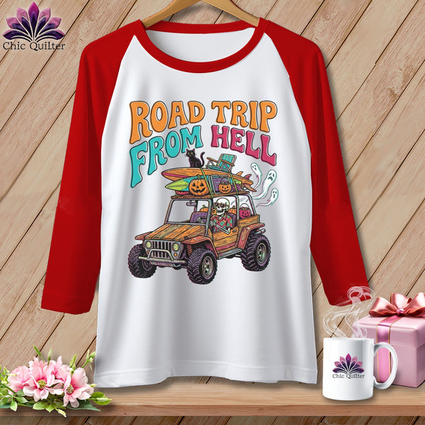 T-shirt graphic: skeleton in jeep with surfboards, pumpkins, and ghosts, saying "Road Trip From Hell".