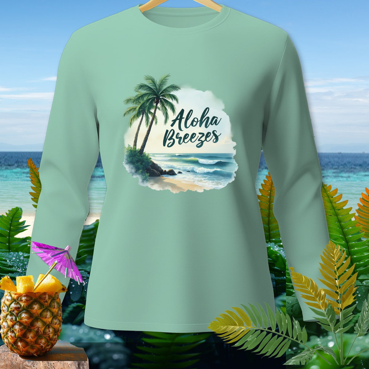 Mint green long-sleeve shirt with "Aloha Breezes" and tropical beach graphic.