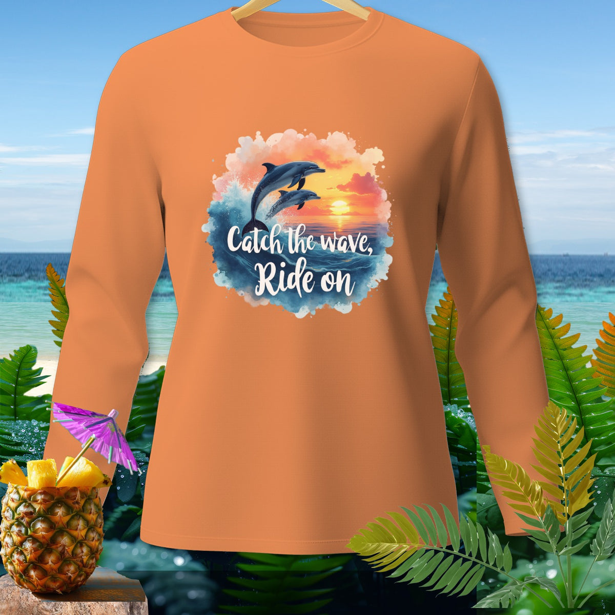 Orange long-sleeve shirt with jumping dolphins graphic and text.