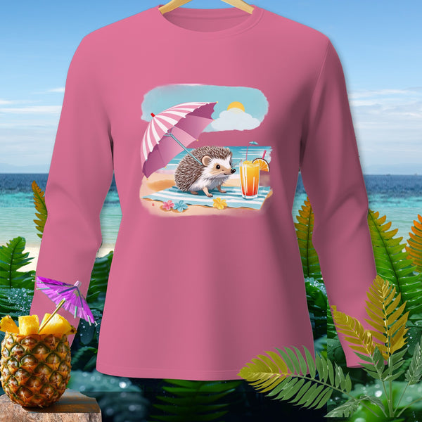 Pink long sleeve shirt with a graphic of a hedgehog on the beach with an umbrella and drink.