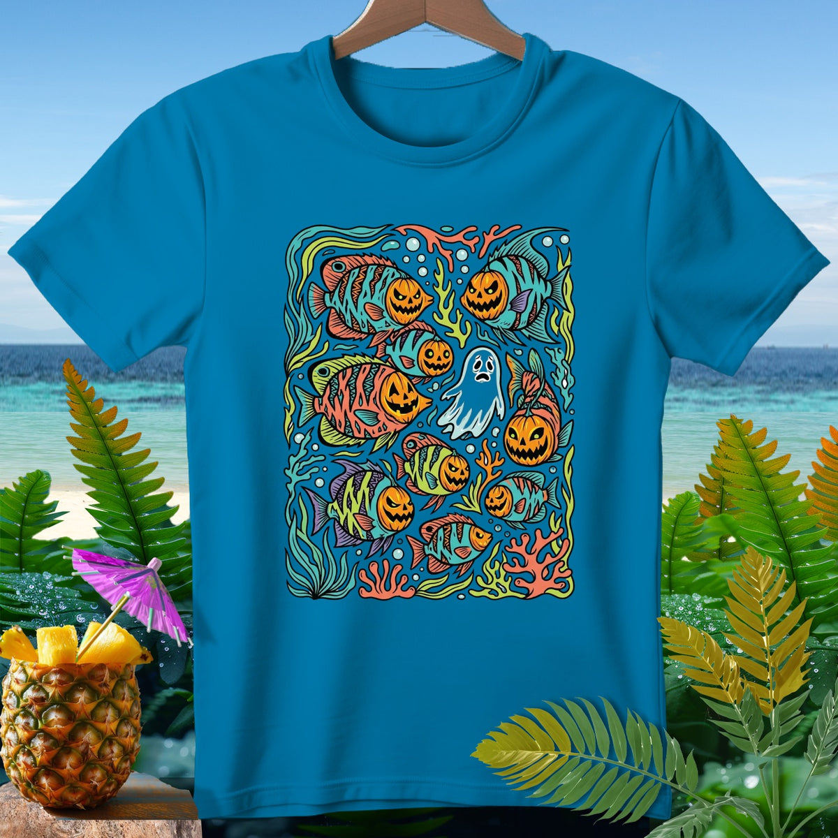 Turquoise t-shirt featuring Halloween fish, pumpkins, and a ghost design.