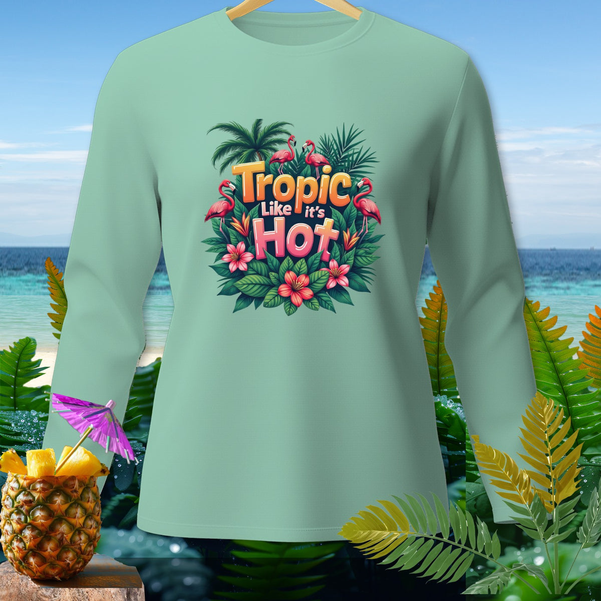 Light teal long-sleeve shirt with "Tropic Like it's Hot" text and flamingos.