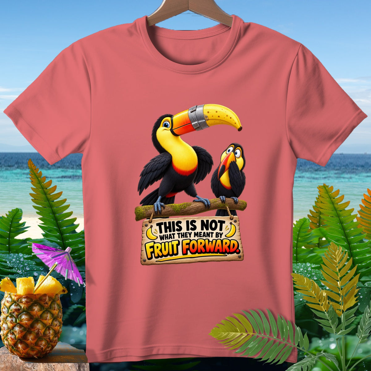 Two toucans on a branch with sign reading "This is not what they meant by Fruit Forward."