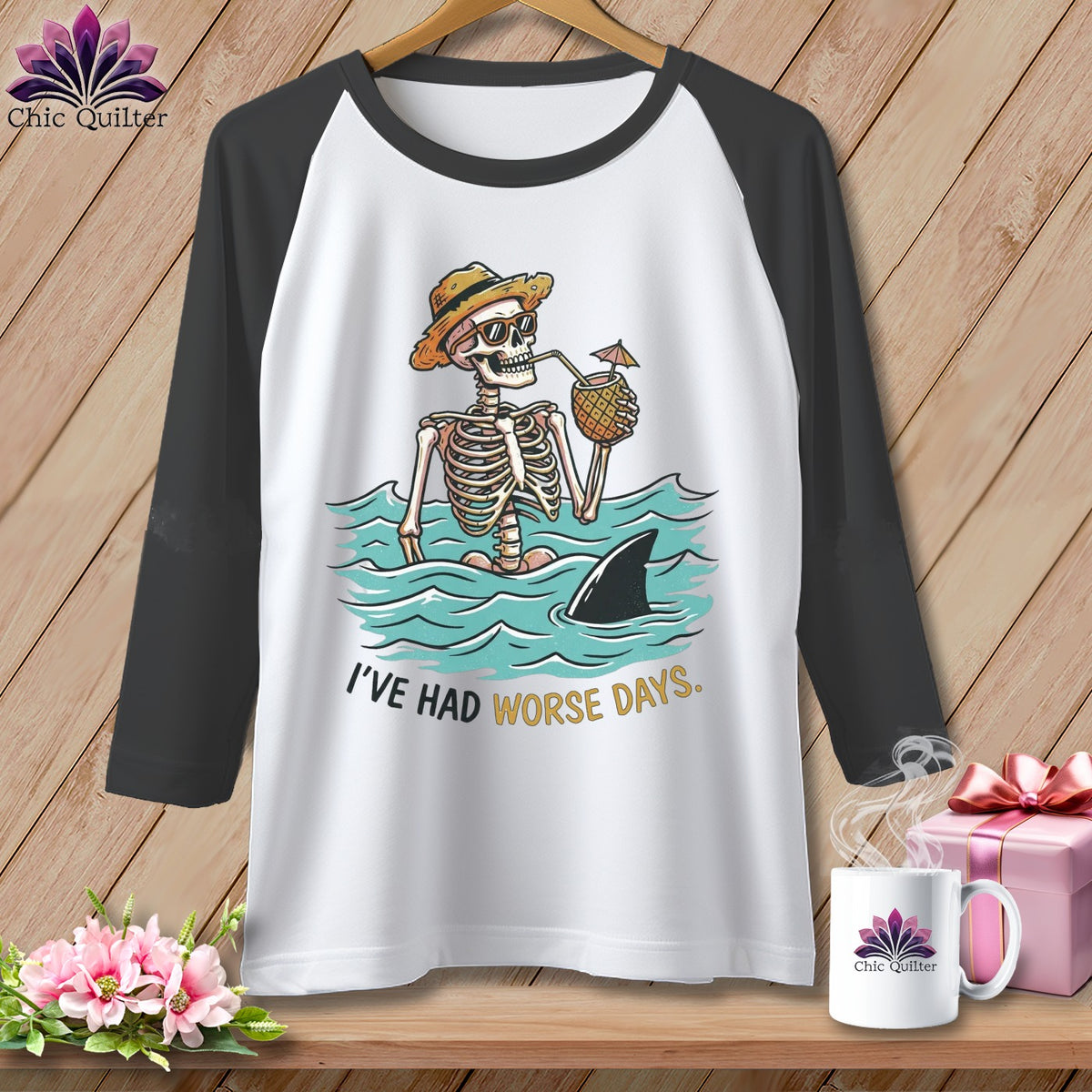White baseball tee with skeleton in water, shark fin, and text "I'VE HAD WORSE DAYS."