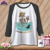 White baseball tee with skeleton in water, shark fin, and text 